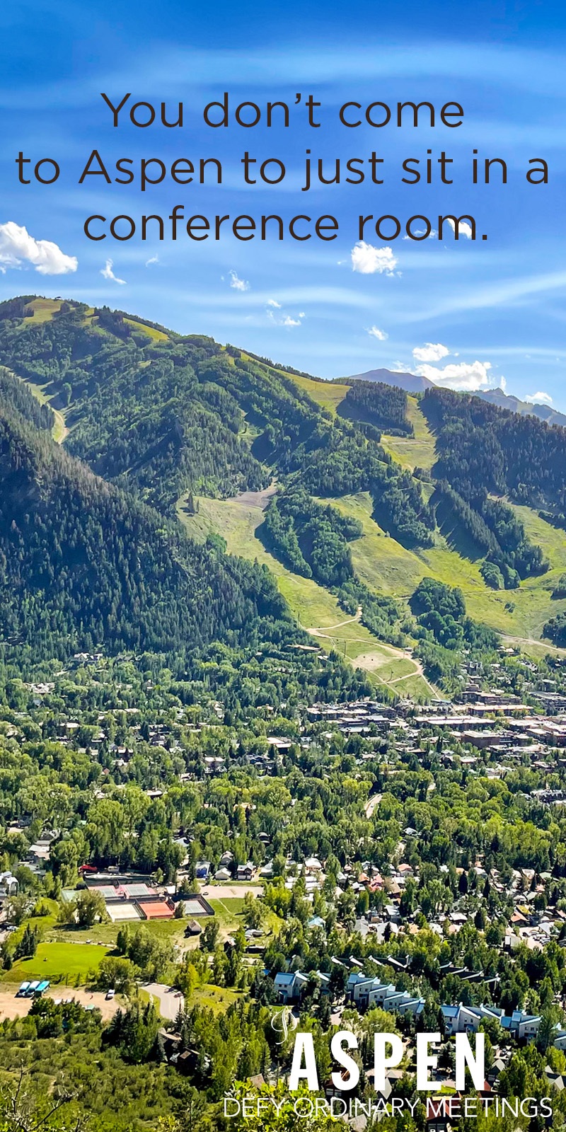 Aerial view of Aspen with green mountains and blue sky; text over image promotes outdoor meetings in Aspen instead of traditional conference rooms.