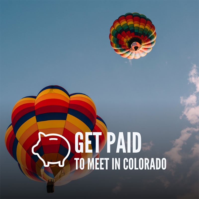Two colorful hot air balloons in the sky with text overlay "Get Paid to Meet in Colorado" and a piggy bank icon, highlighting the excellent Colorado Conference Centers.